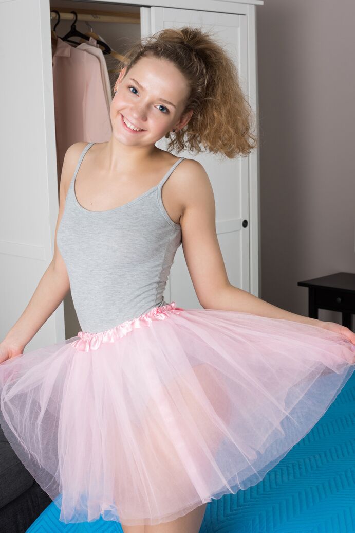 20P Tiny teen Faina removes tutu and onesie to model naked on her bed