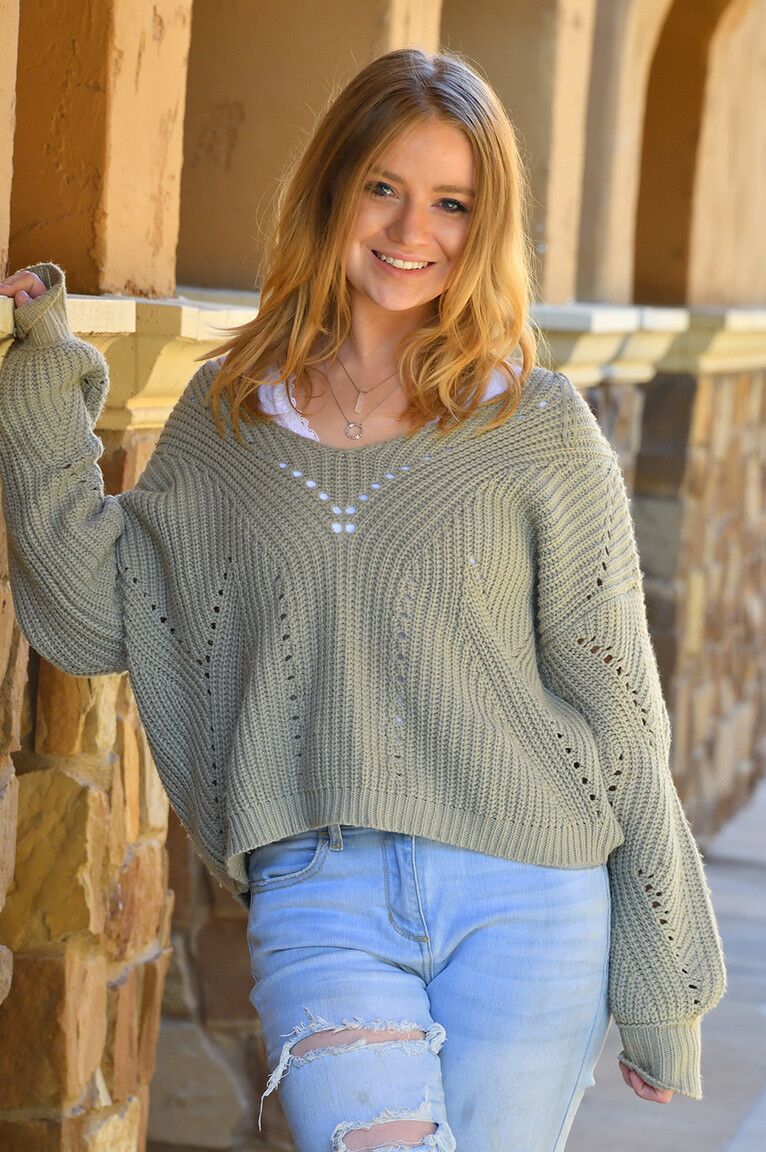 15P Young redhead Elana pulls down ripped jeans before sliding a thong to one side