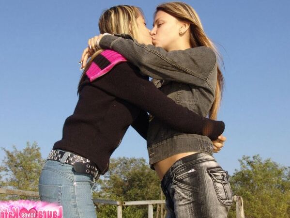 15P Young lesbians Lauraa and Katrina exposes their small tits while at the beach
