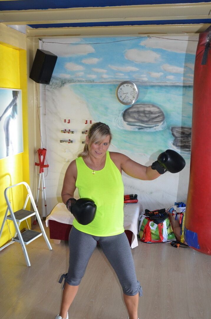 16P Middle-aged blonde Sweet Susi gets naked after working out with a punching bag