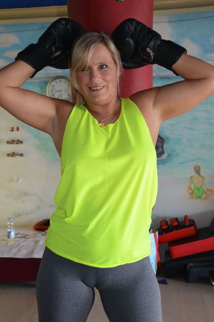 16P Middle-aged blonde Sweet Susi gets naked after working out with a punching bag