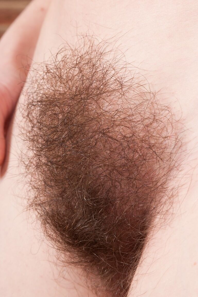 16P Amateur with big natural tits reveals unshaven pits and bush while disrobing