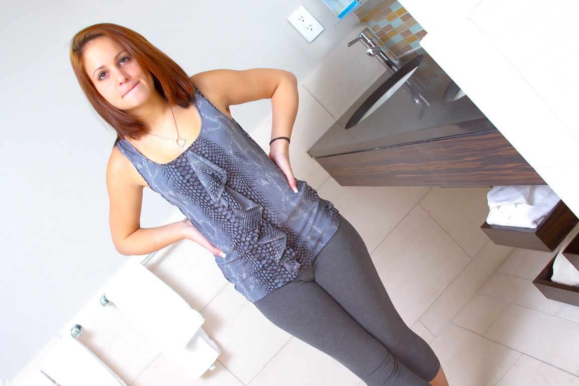 16P Cute redhead removes her leggings and pretties to pose nude for the first time