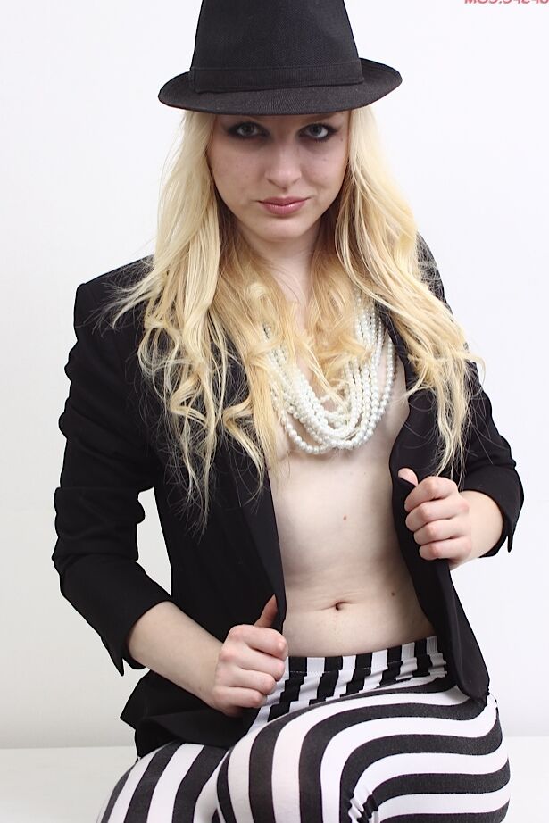 15P Natural blonde Bella Lei strips down to black heels on top of a table