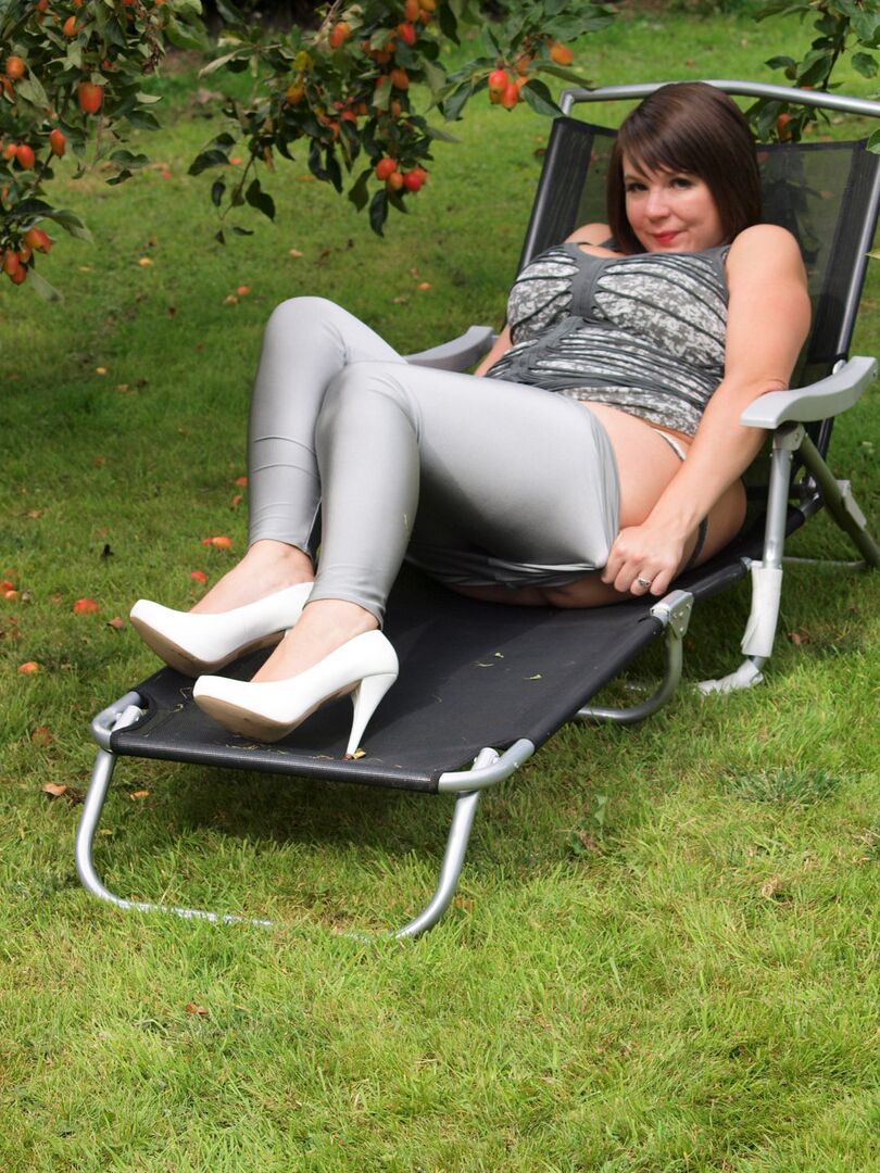16P Amateur plumper Roxy uncovers her huge tits before touching her twat in a yard