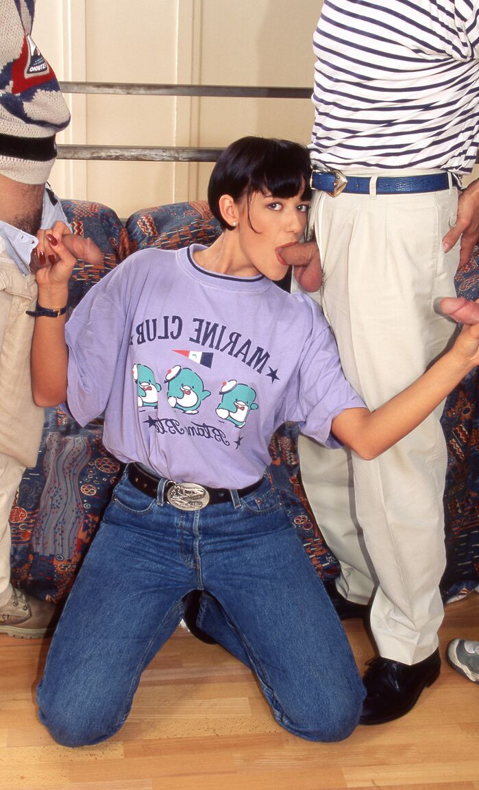 12P Dark-haired woman Carol Rouge does a DP during a gangbang scene