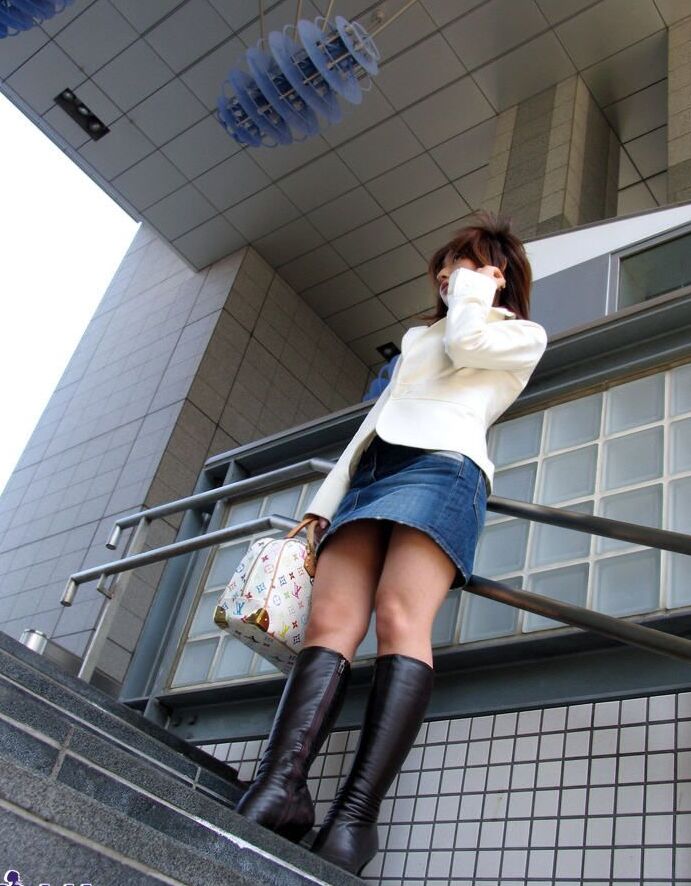 15P Young Japanese redhead Sayuri ends up completely naked on top of her bed