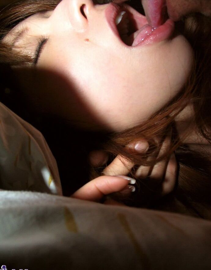 15P Young Japanese redhead Sayuri ends up completely naked on top of her bed