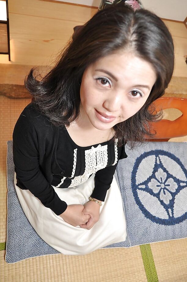 16P Miyoko Tanigawa is featured in a hot undressing scene in her living room
