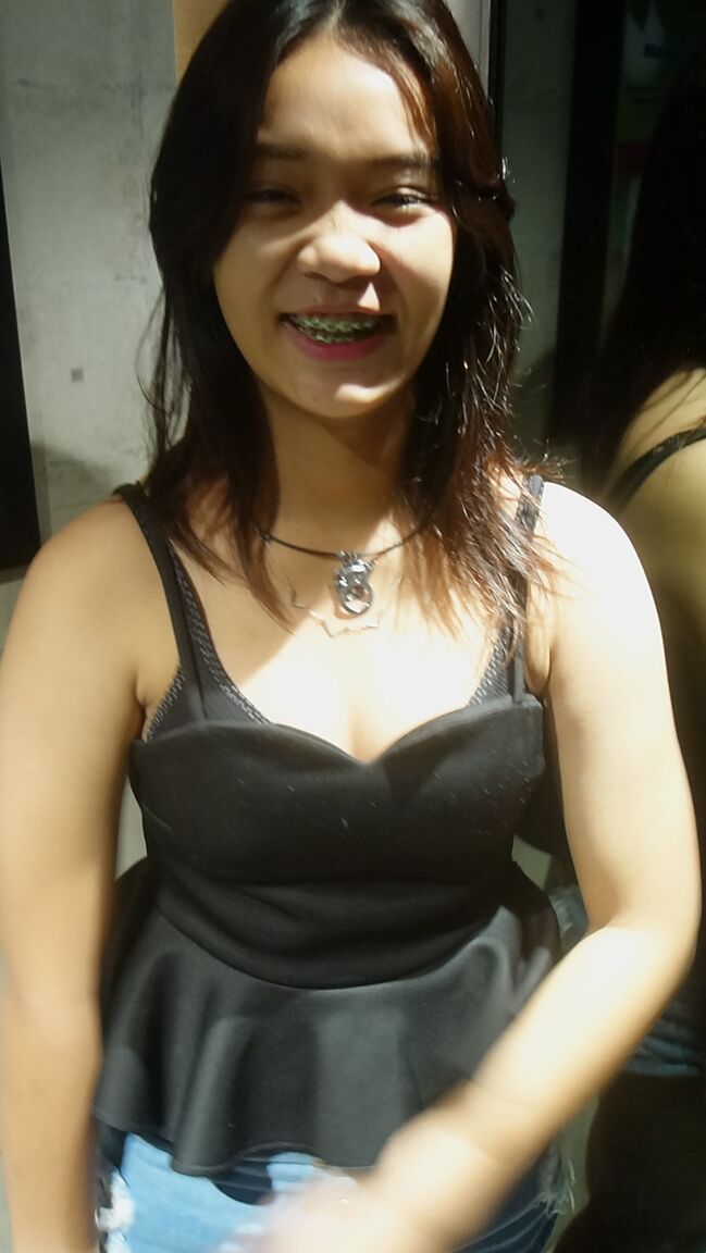 17P Cute Thai girl in braces and flip flops lounges about in her shorts and blouse
