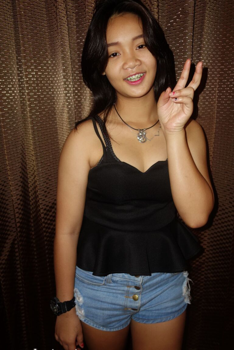 17P Cute Thai girl in braces and flip flops lounges about in her shorts and blouse