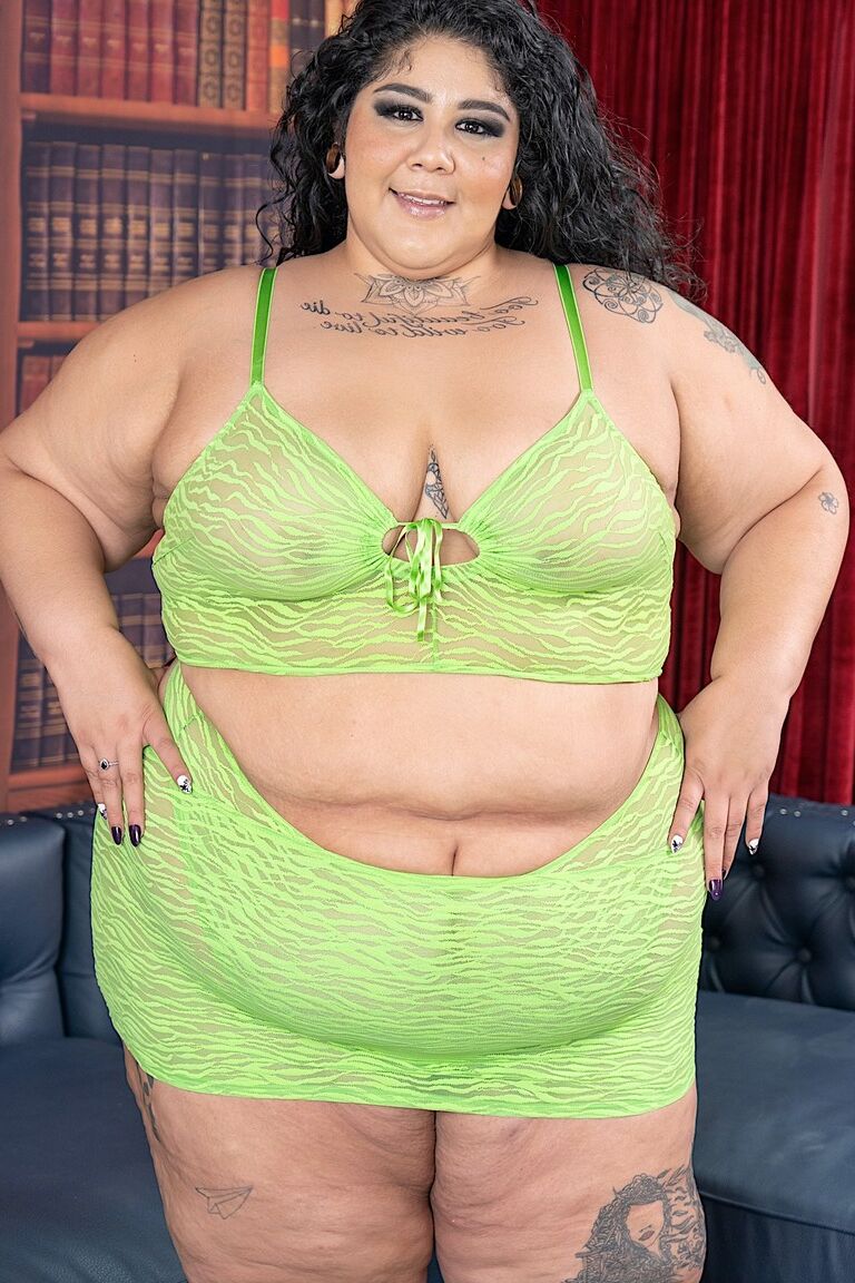 16P SSBBW Crystal Blue strips down to her footwear on a sofa during solo action
