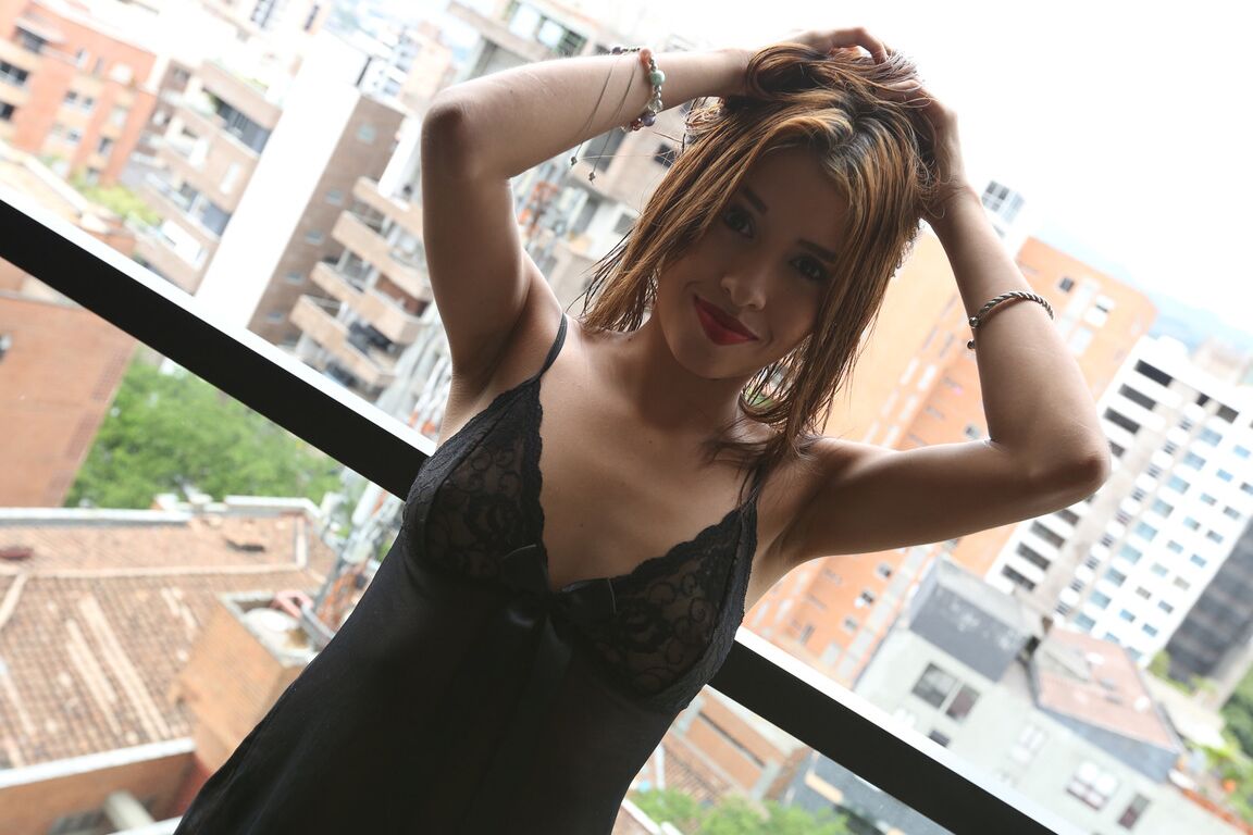 19P Brunette Colombian Laura Brown teases with her big bottom and tiny tits