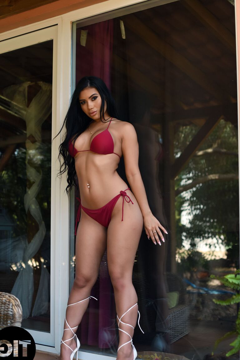 21P Asian with big juggs Nicole Snow shows her bosom after stripping her bikini