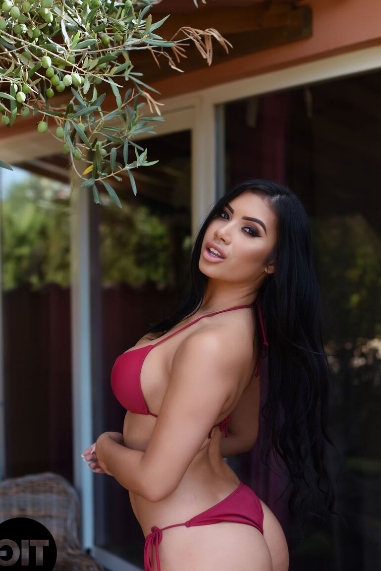 21P Asian with big juggs Nicole Snow shows her bosom after stripping her bikini