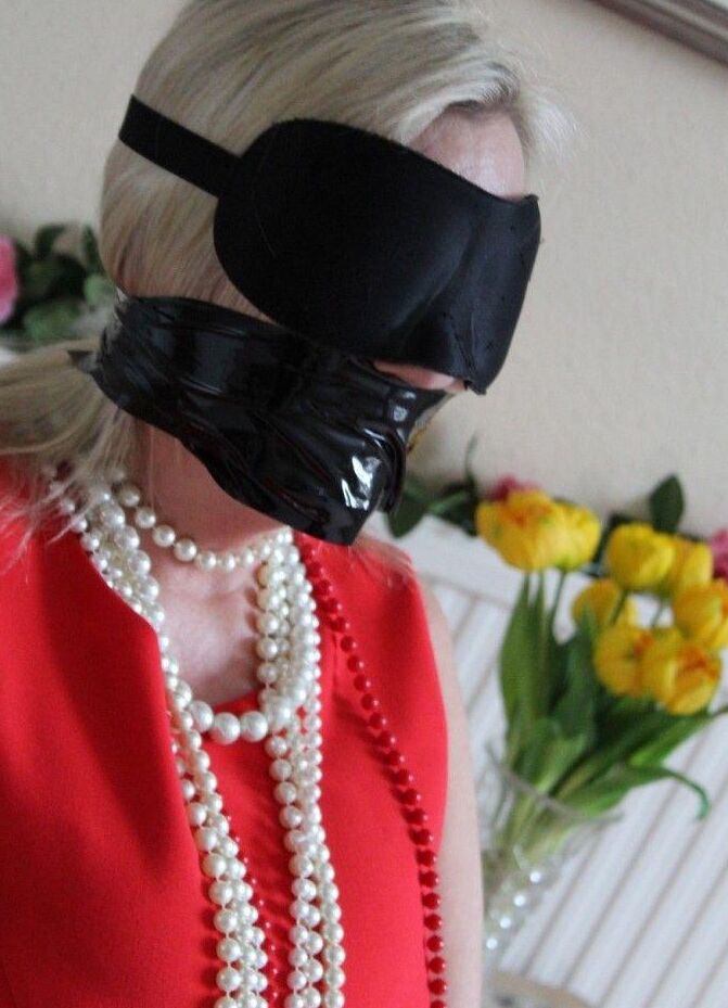 16P Older blonde is tied up, gagged and blindfolded in a few outfits
