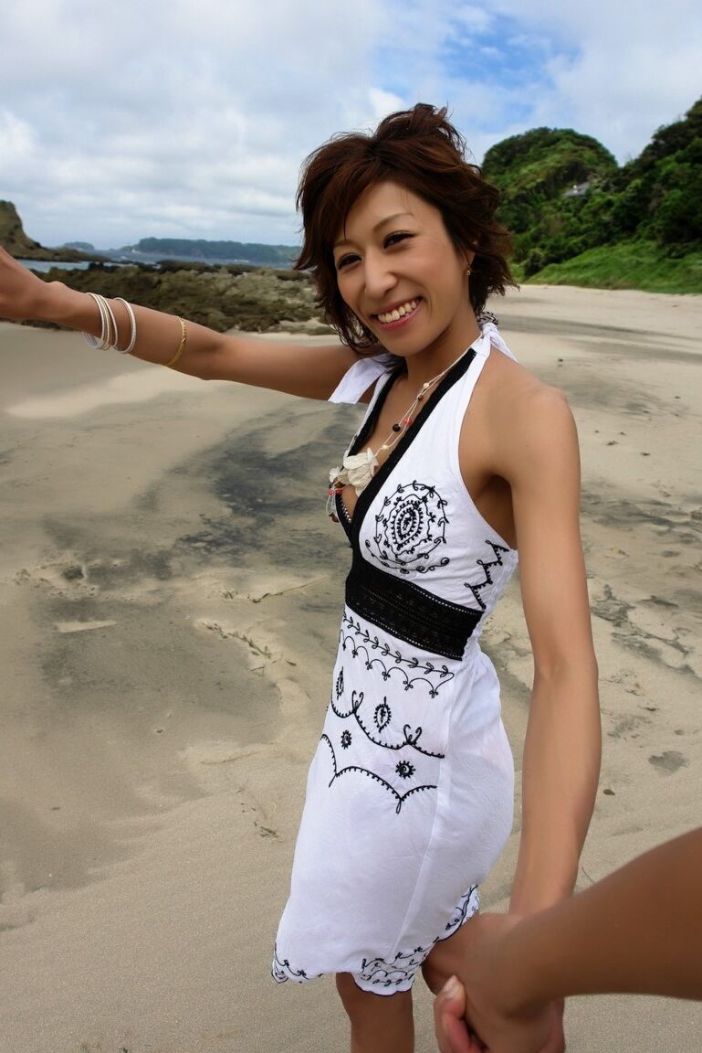 12P Japanese redhead ends up with a mouthful of cum after a BJ on the beach