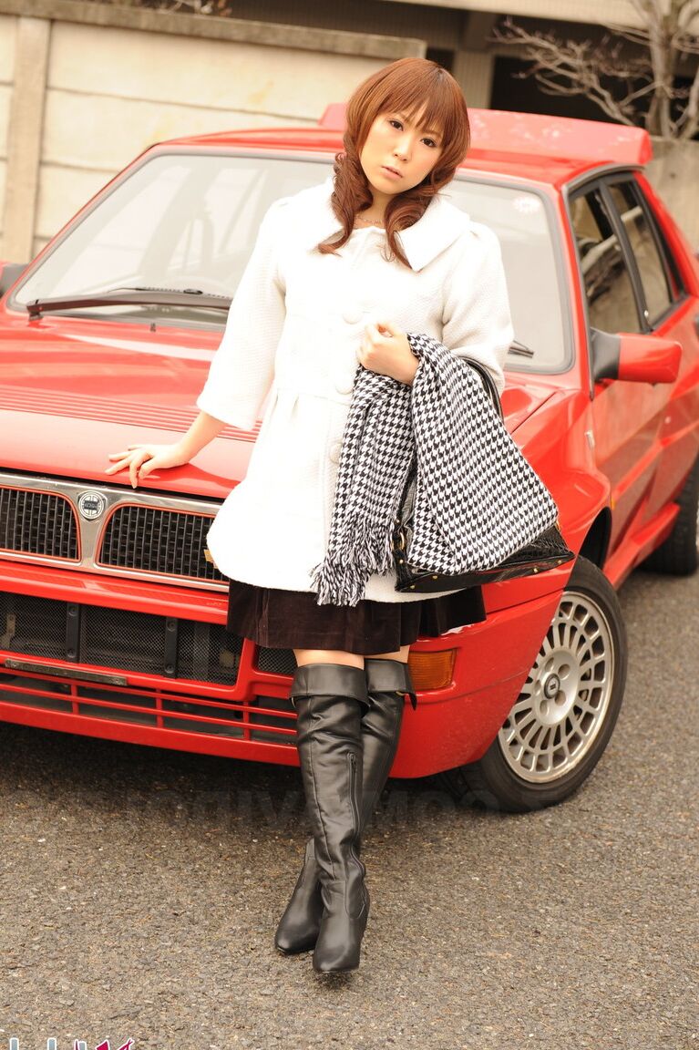 15P Japanese model Yuko Morita shows some leg while clothed in black boots
