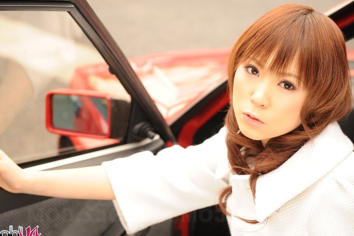 15P Japanese model Yuko Morita shows some leg while clothed in black boots