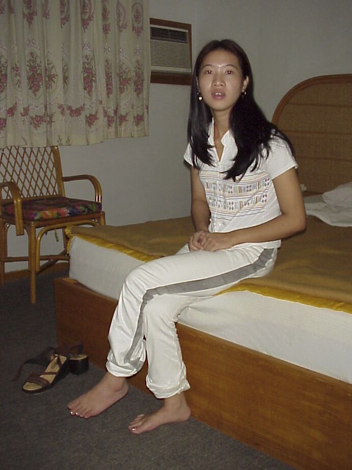 16P Naughty asian babe taking off her clothes and posing on the bed