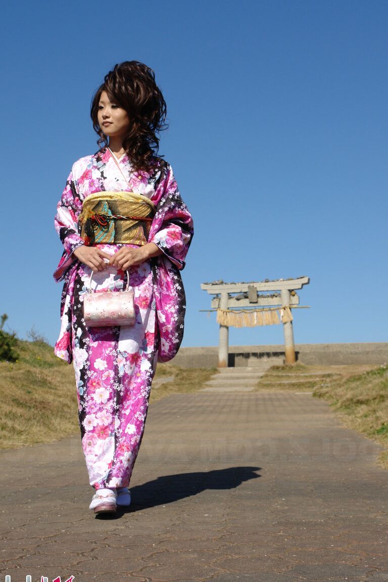 15P Asian model Chiaki strolls along the beach and surrounding area in a kimono