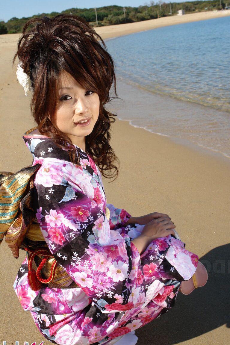 15P Asian model Chiaki strolls along the beach and surrounding area in a kimono