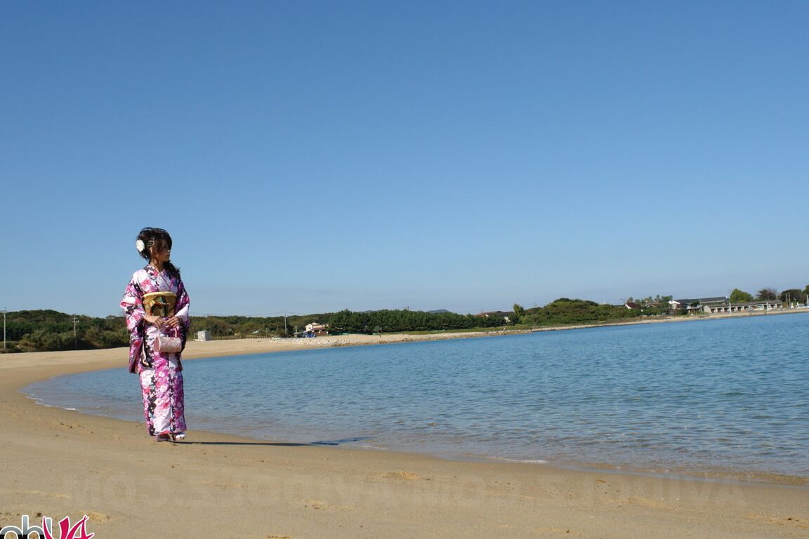 15P Asian model Chiaki strolls along the beach and surrounding area in a kimono