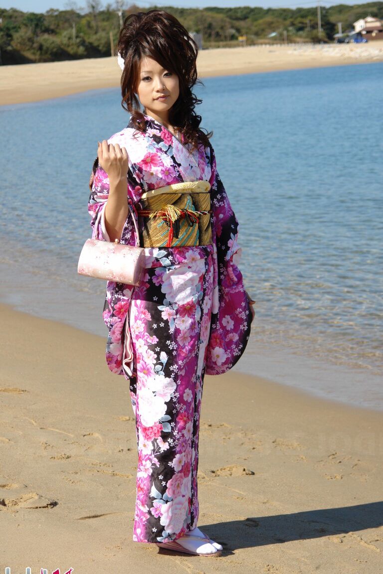 15P Asian model Chiaki strolls along the beach and surrounding area in a kimono