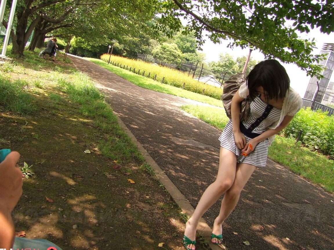 21P Asian sweetie Mitsuki sticks a dong in her throat and licks the top of it