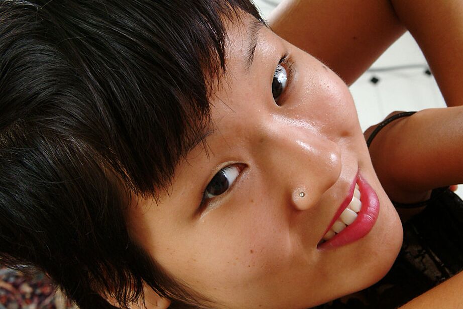 16P Close up of petite Oriental chick Vicky revealing nice tits and beaver