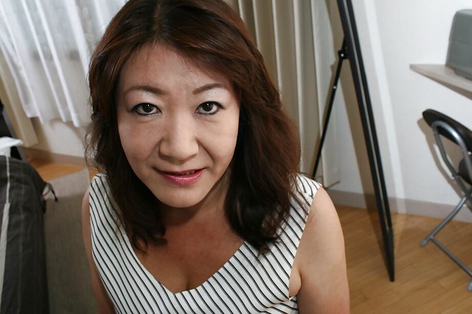 16P Asian granny Michiko Okawa undressing and exposing her hairy twat in close up