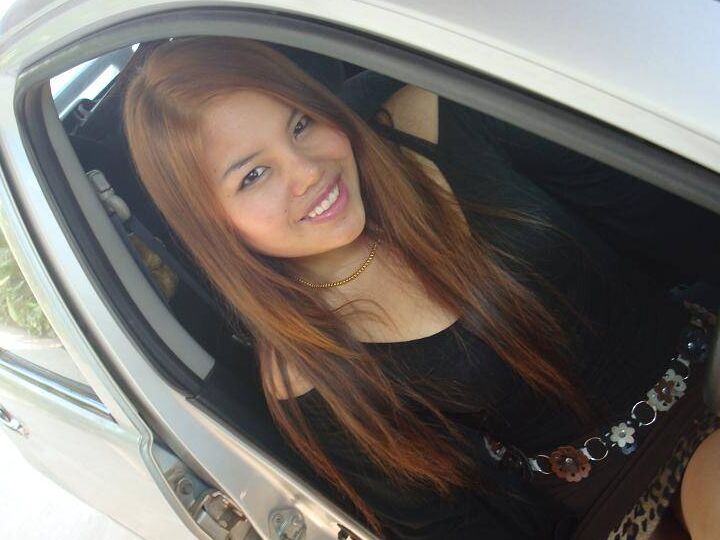 14P Filipino girl in a black dress shows her bare legs while modeling non nude