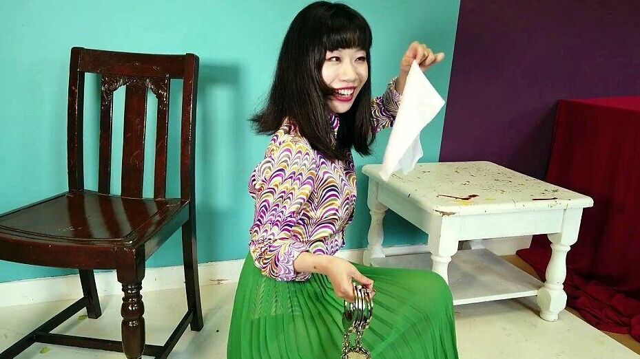 16P Close Asian chick removes ankle cuffs after being chained to a chair