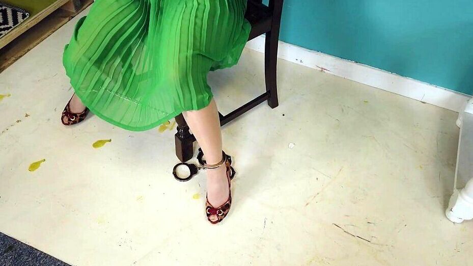16P Close Asian chick removes ankle cuffs after being chained to a chair