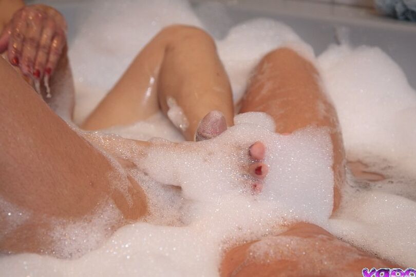 17P Asian masseuse Mika Tan soaps up her client before pleasuring him in a bathtub