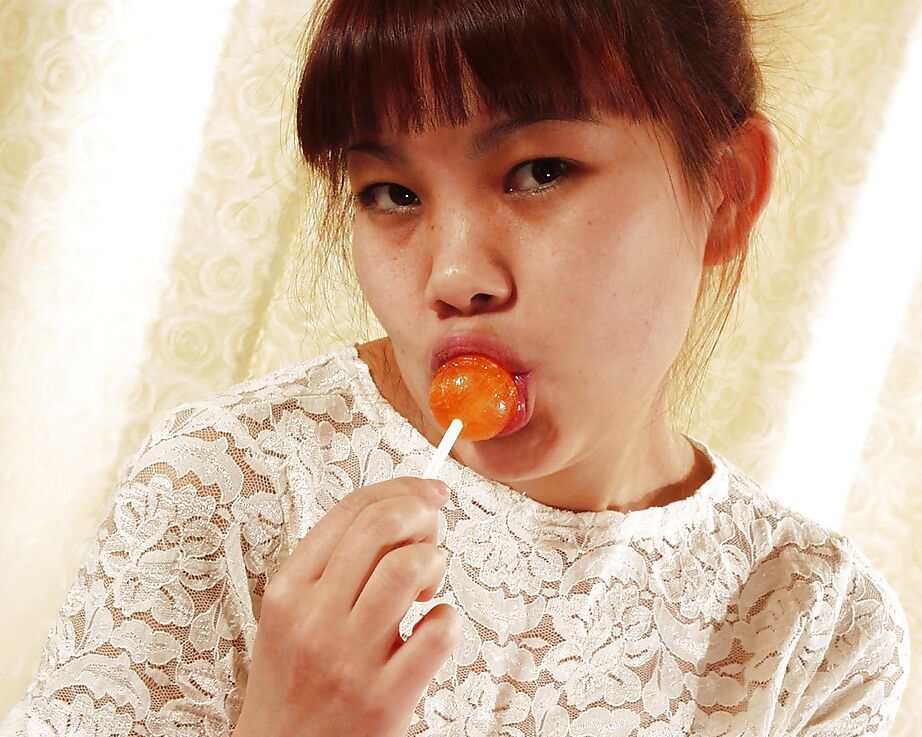 16P Lecherous asian girl undressing and teasing her gash with candy