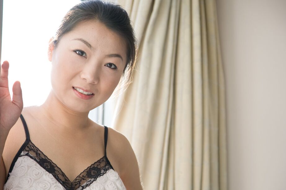 16P Mature Asian Ada E prances naked showing her perky tits in the window