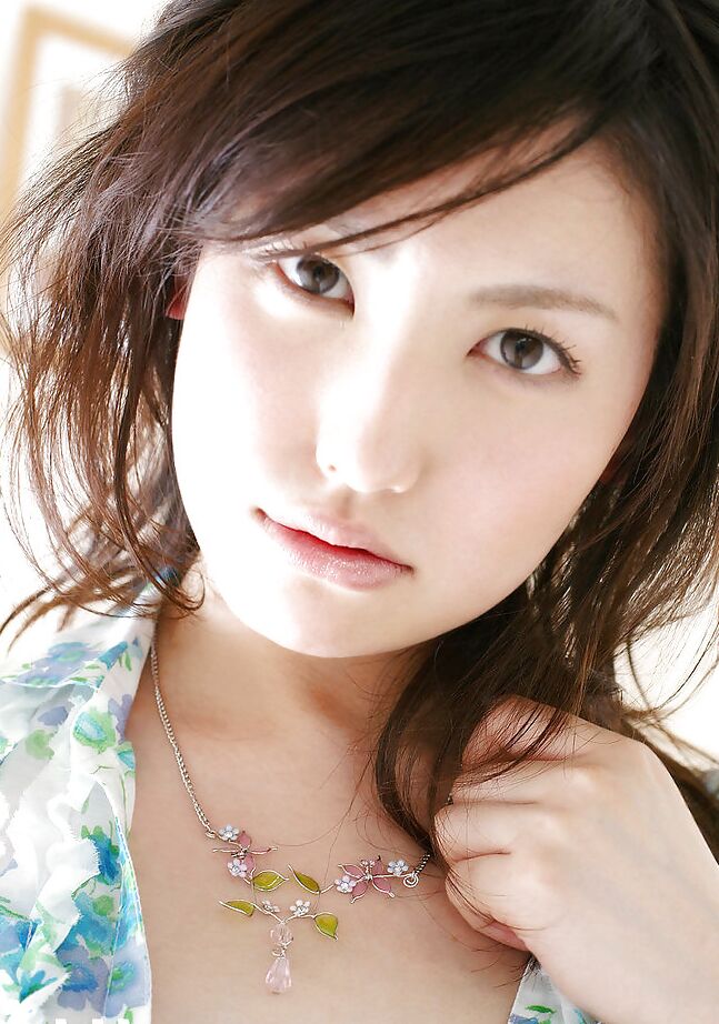 15P Sweet asian babe Takako Kitahara stripping and posing on the bed