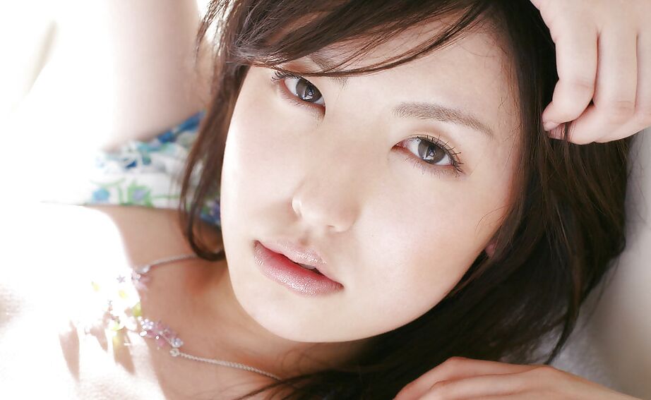 15P Sweet asian babe Takako Kitahara stripping and posing on the bed
