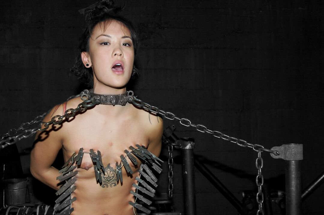 21P Asian babe Jandi Lin gets chained and abused by a kinky dom in bondage action