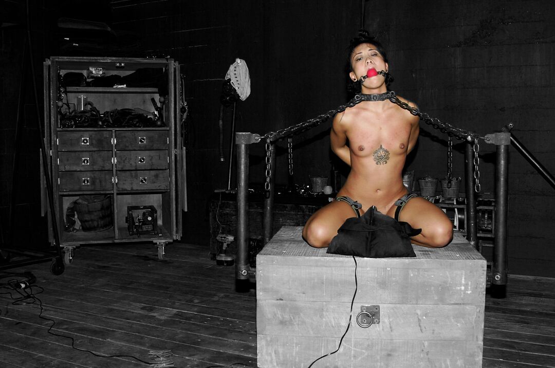21P Asian babe Jandi Lin gets chained and abused by a kinky dom in bondage action
