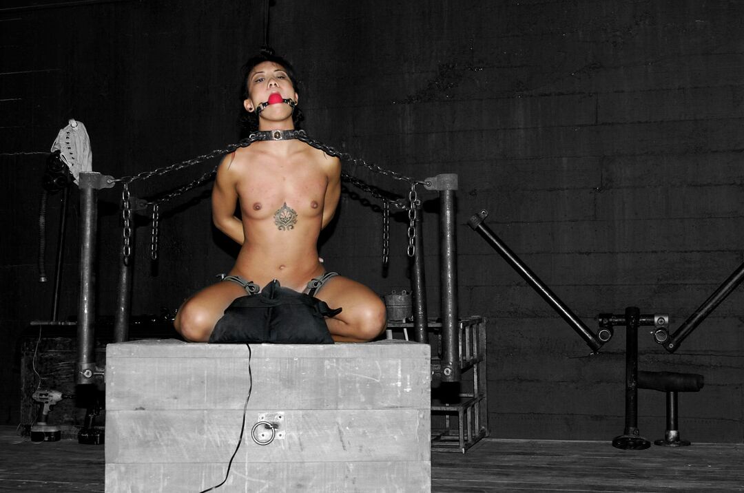 21P Asian babe Jandi Lin gets chained and abused by a kinky dom in bondage action