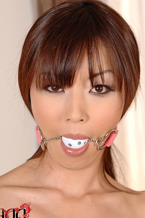10P Naked Japanese model Marica Hase is left ball gagged and handcuffed on table