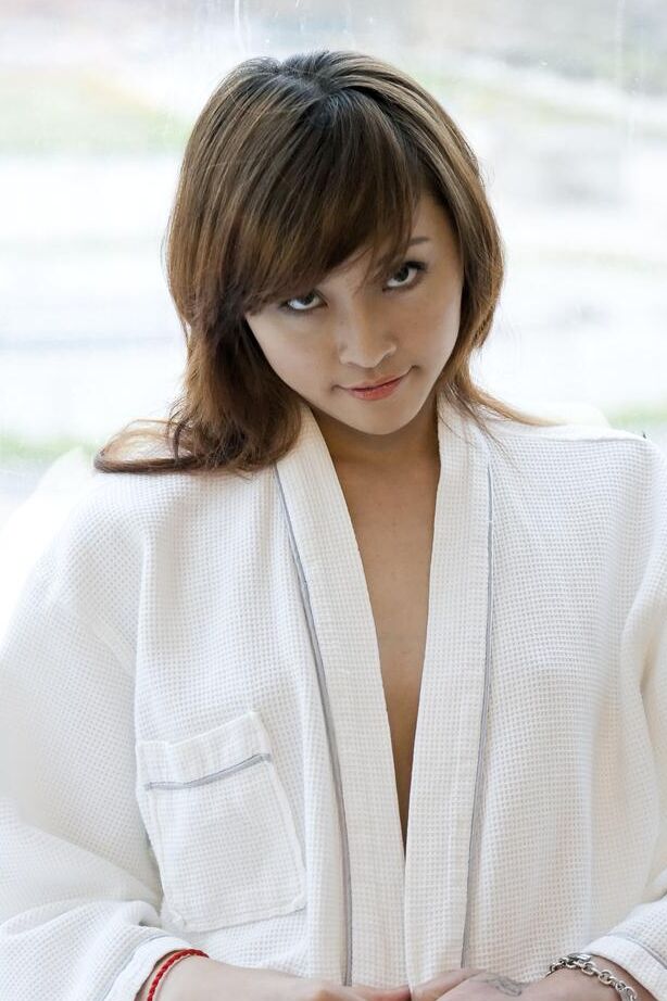 16P Petite Asian teen Lavinia Chan doffs a robe to pose naked on a window sill