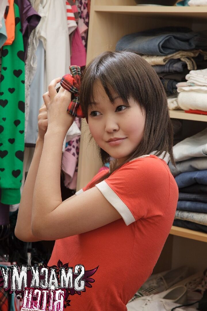 15P Aliona stands in front of a closet stuffed with clothes and searches for the
