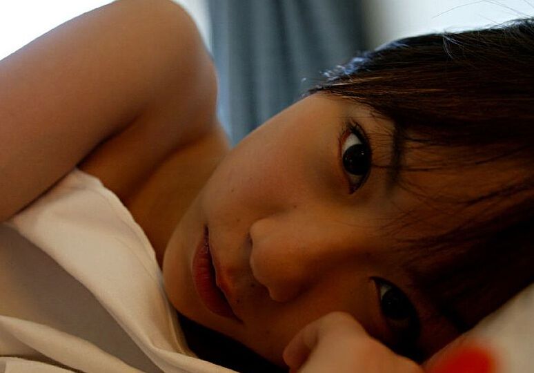 16P Japanese girl Kurumi Morishita displays her firm tits while getting changed