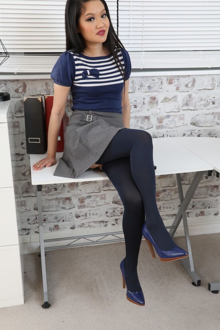 16P Asian secretary Louisa Lu uncups her tiny tits in a garter belt and nylons