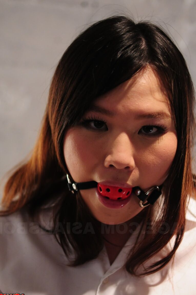 15P Asian chick Aki Sasahara is fitted with gag in white blouse and black skirt