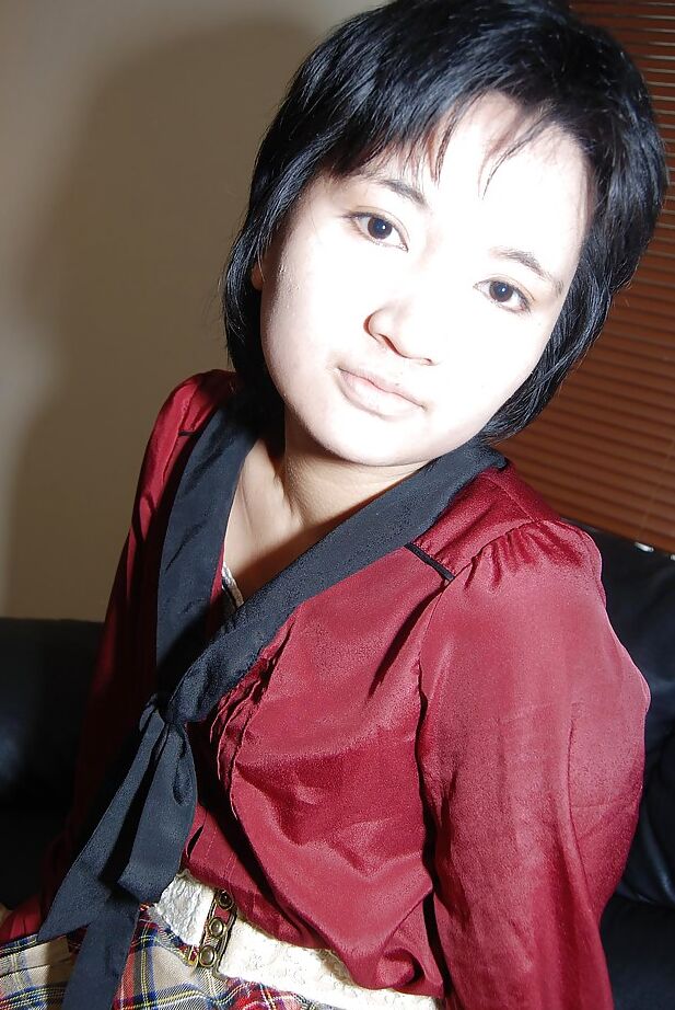 16P Short-haired asian chick in pantyhose undressing and exposing her twat