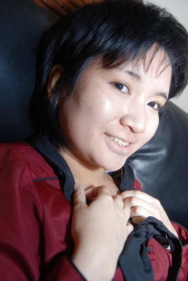 16P Short-haired asian chick in pantyhose undressing and exposing her twat